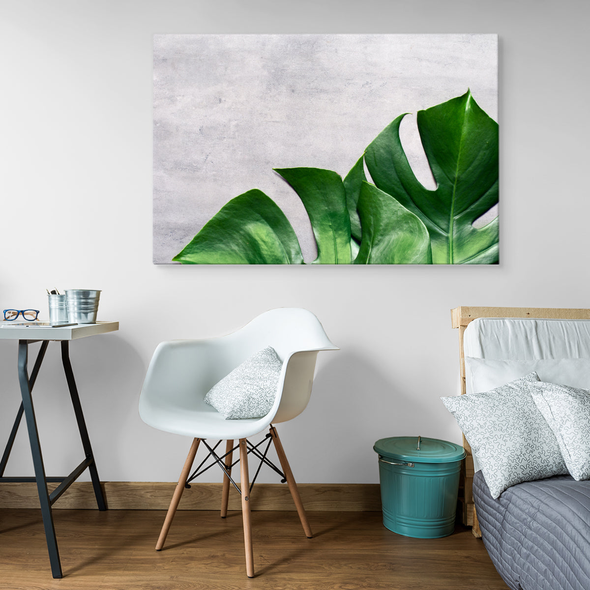 Monstera blader på en betong bakgrunn