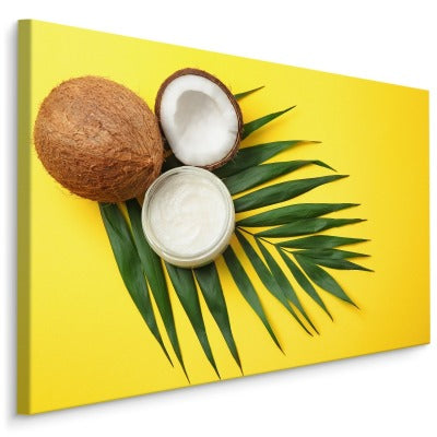Blad- og kokosnøttfrukt på gul bakgrunn